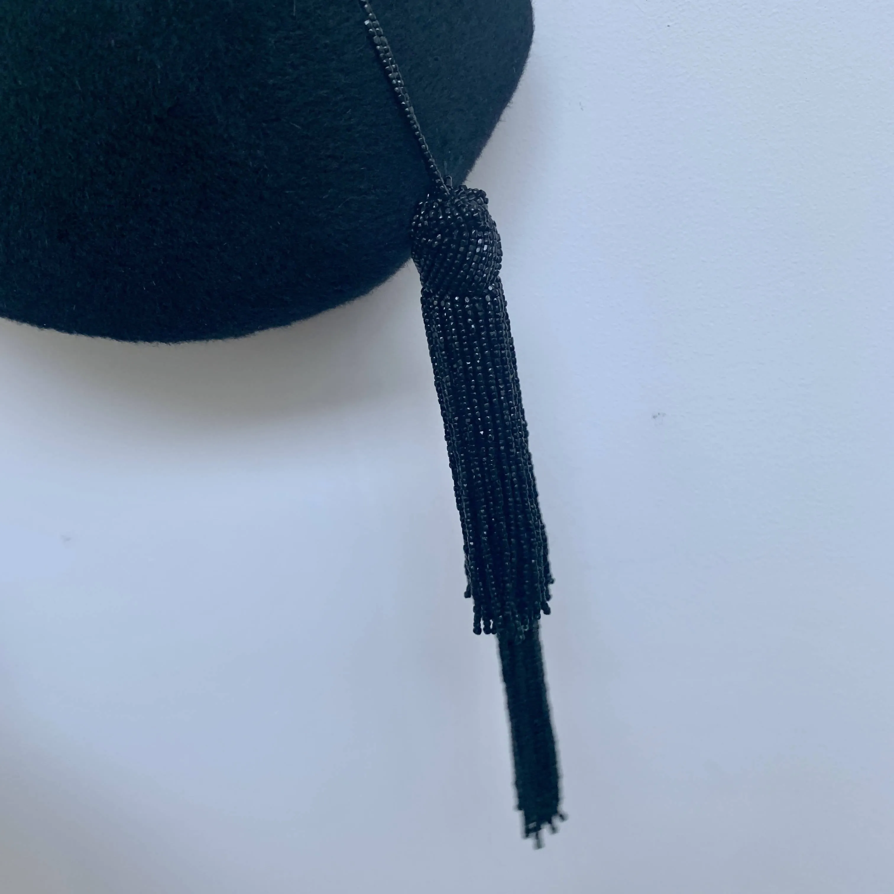 Elegant Stephen Jones black velvety felt beret fascinator with beaded tussles