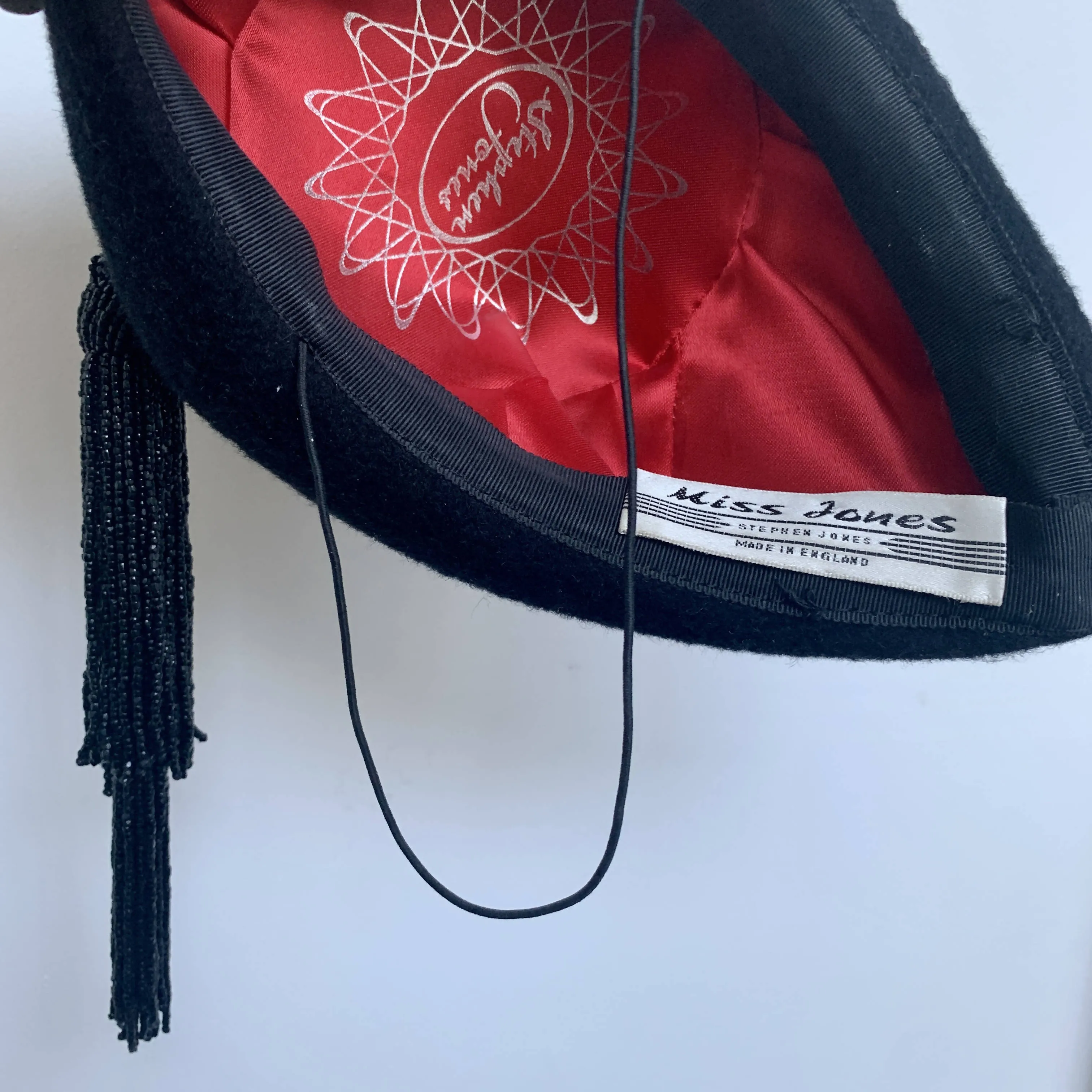 Elegant Stephen Jones black velvety felt beret fascinator with beaded tussles